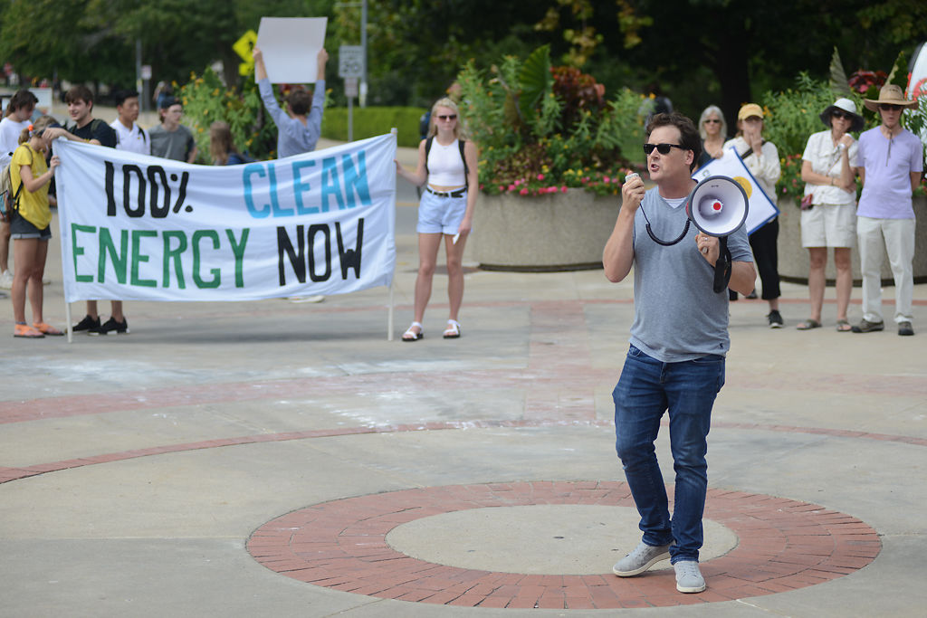 James Owen speaks to protestors Friday at the Climate March